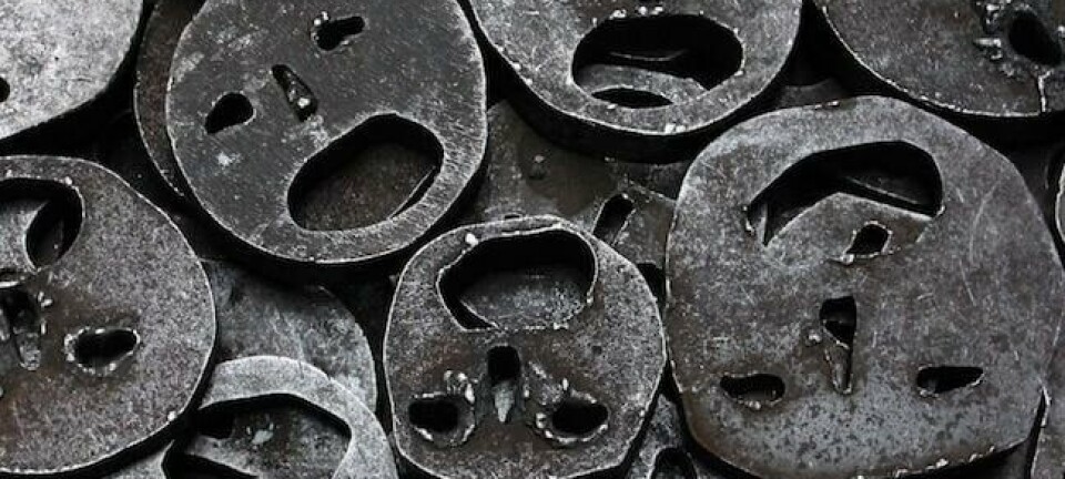 collection of metal masks cut with smiley faces