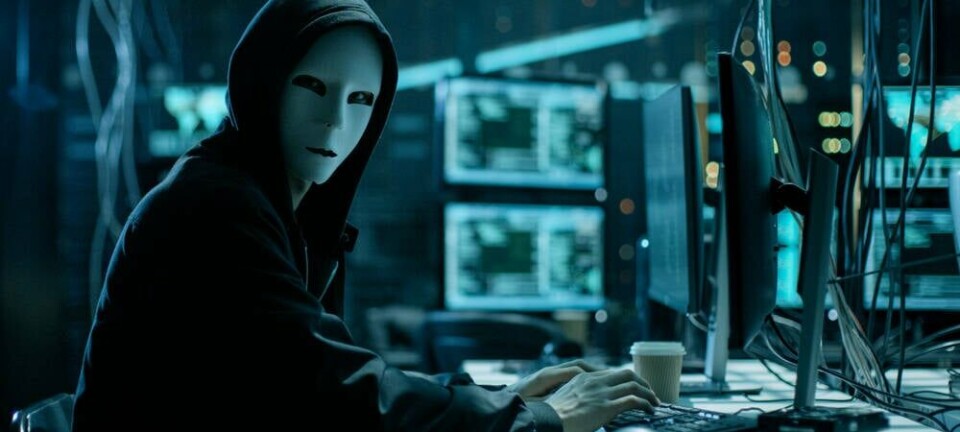 hacker_wearing_mask_at_computer