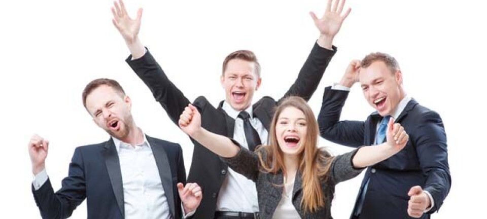 Happy business people celebrate. Photo by Shutterstock