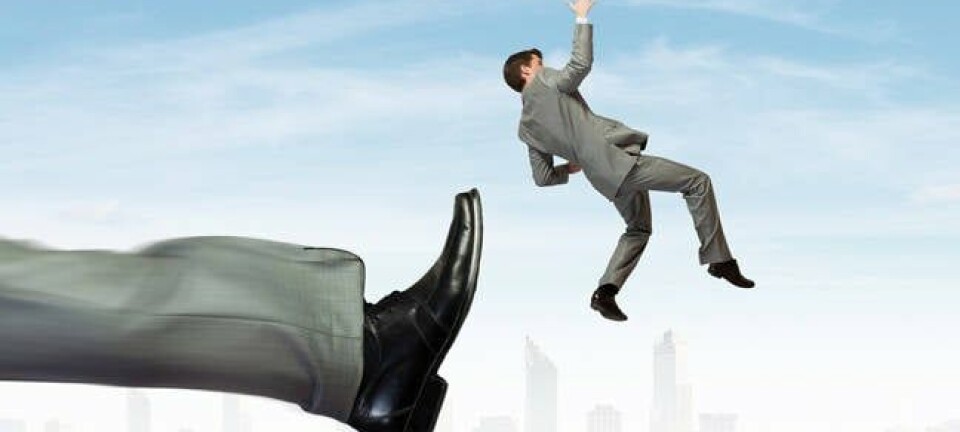 Man being kicked by oversized leg with city in background