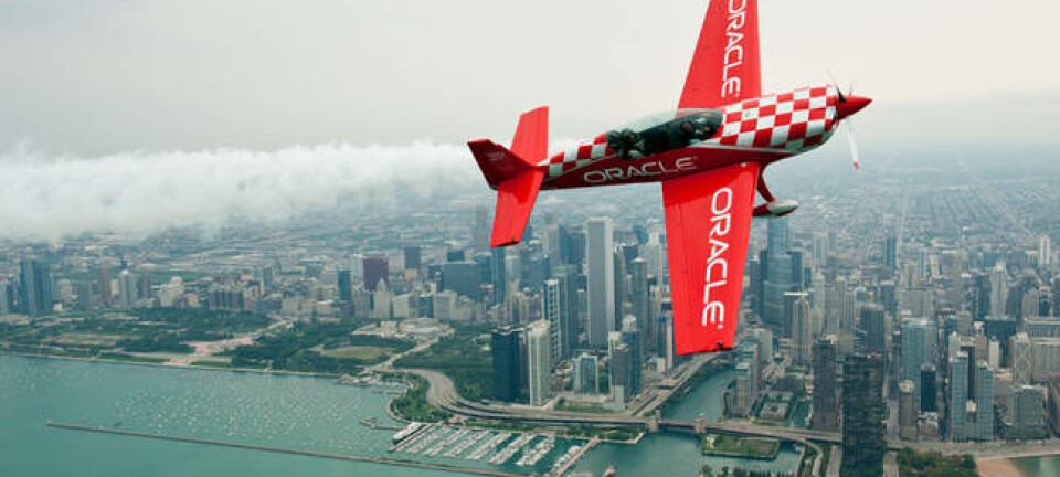 Team Oracle 8 ailerons custom built plane  flies in front of the Chicago skyline