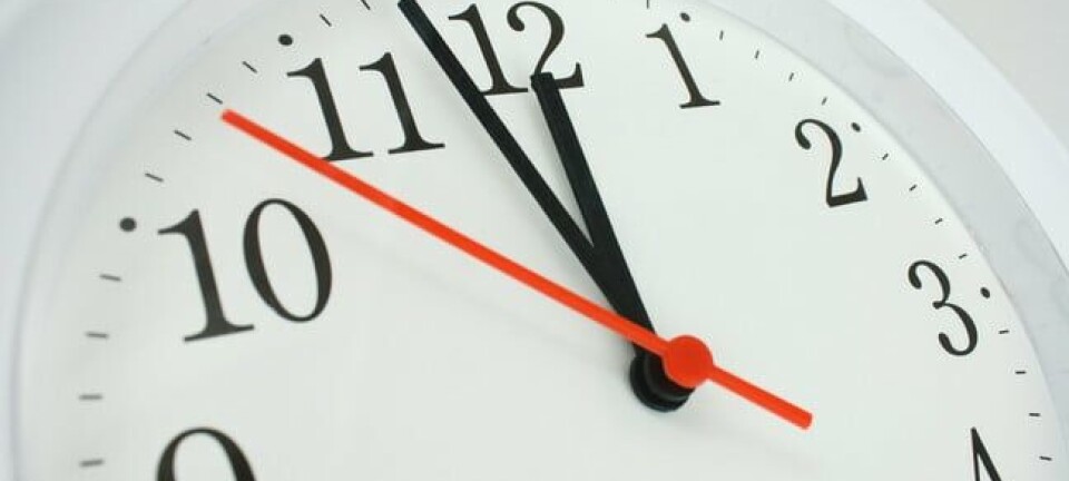 Clock face showing the hands at two minutes to midnight