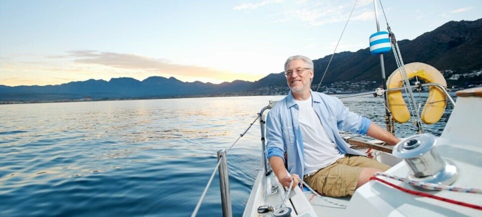 Grey haired man on a yacht