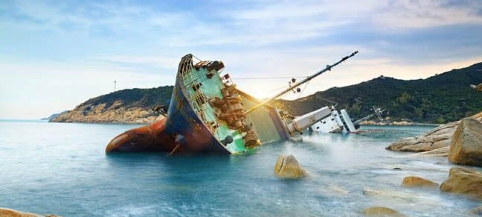 wrecked cargo ship abandoned on sea bay. pHOTO BY shUTTERSTOCK