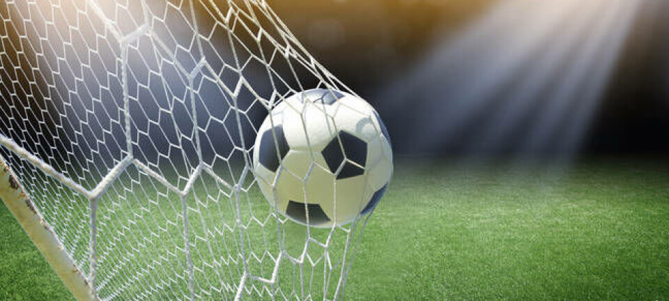 Football goes into the net/ photo by shutterstock