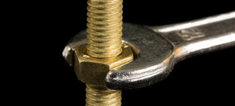 Spanner and bolt photo via Shutterstock