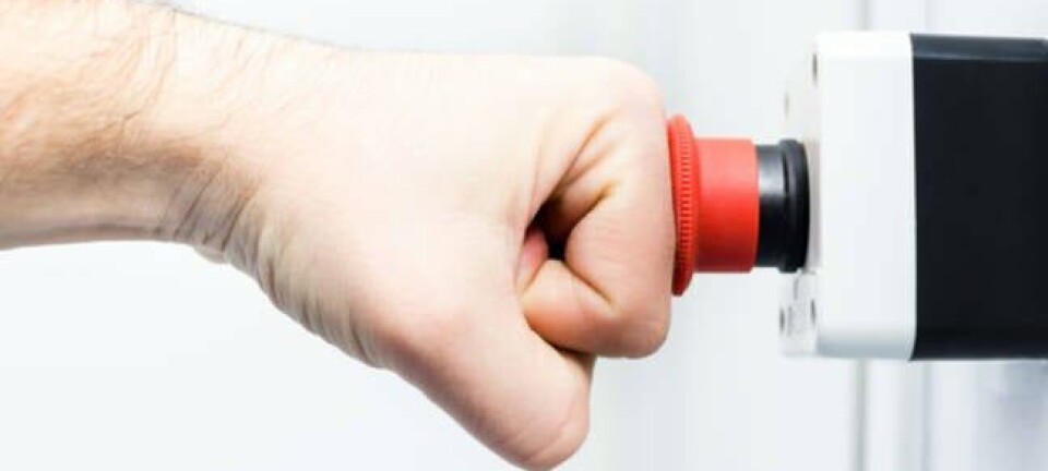 Picture of a person's fist hitting an emergency red button