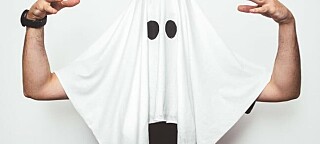 Man wearing ghost costume