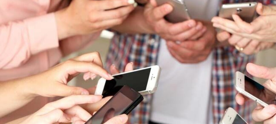 Young 'creatives' whip out their mobile phones. Photo by Shutterstock