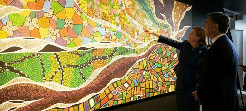 Deputy Prime Minister and Minister for Defence, the Hon Richard Marles MP and Chief Defence Scientist Professor Tanya Monro, AC, unveil an artwork created by local Kaurna Traditional Owners Aunty Buster, Corey and Nasyah Turner during the launch of the Defence High Performance Computing capability at the Defence Science and Technology Group site in the Edinburgh Defence Precinct, South Australia