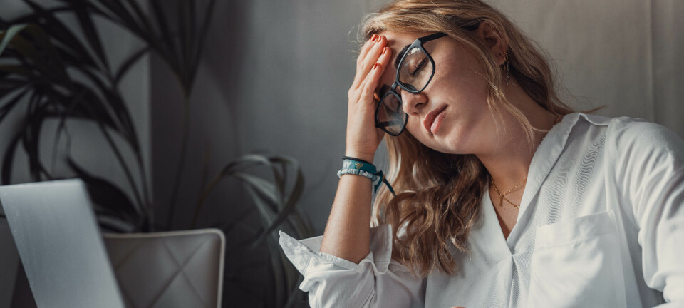 Frustrated woman using PC