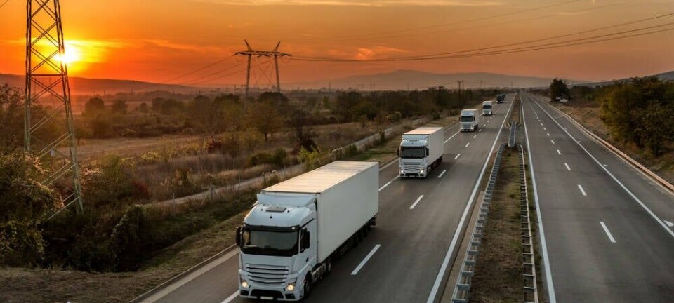 truck_fleet_on_highway_at_sunset