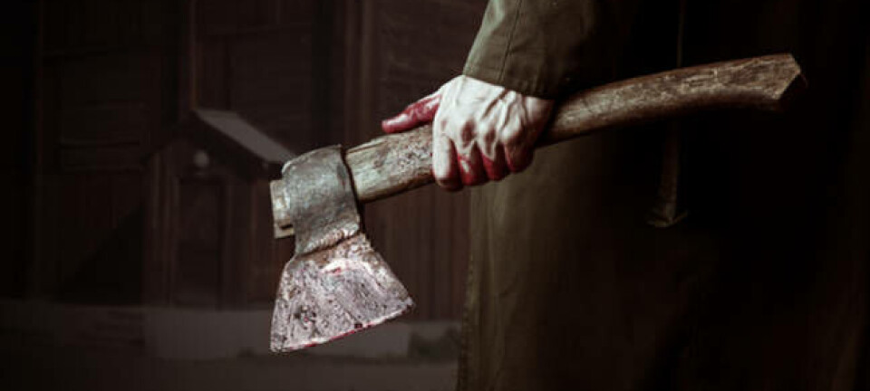 man walks with bloody axe