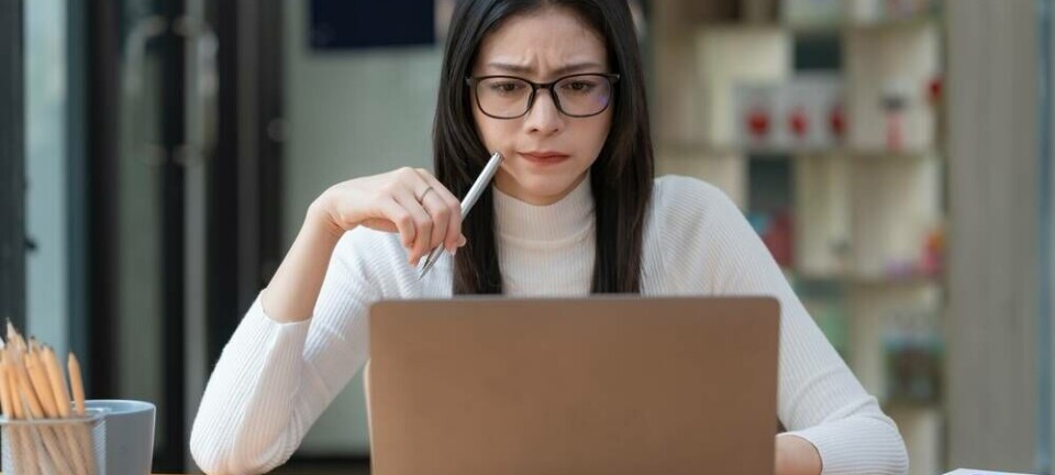 shutterstock Concerned female worker looking at laptop screen
