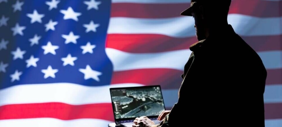 Generic shot of US military person in front of the US flag