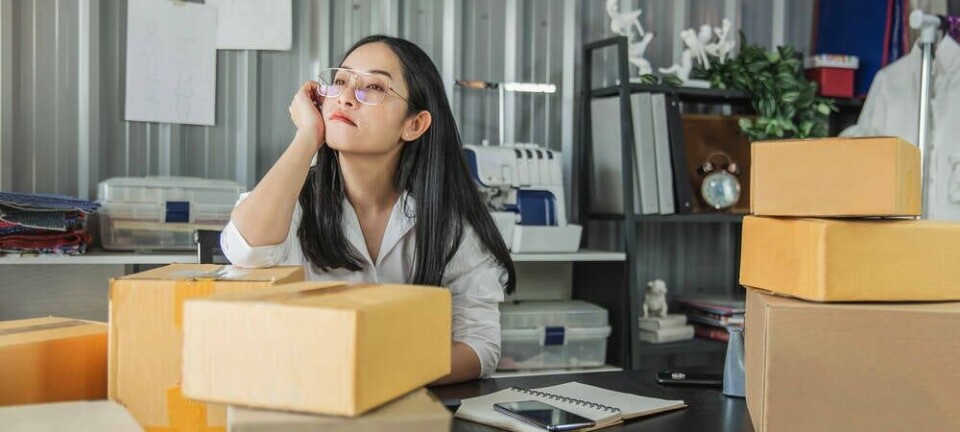 young startup exec boxes up things