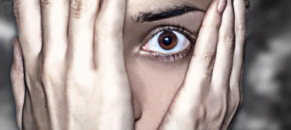 Person hides face in shocked anticipation of something horrible. Photo via shutterstock