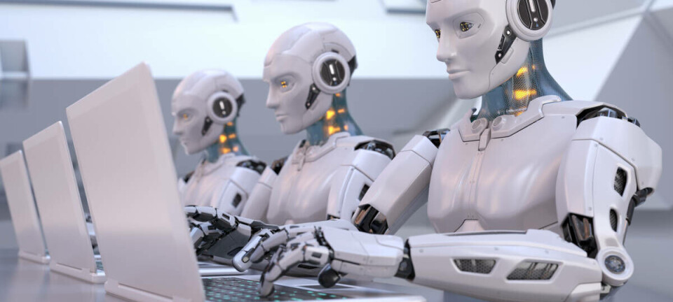 Robots working away on laptops