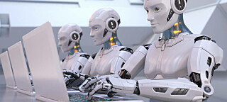 Robots working away on laptops