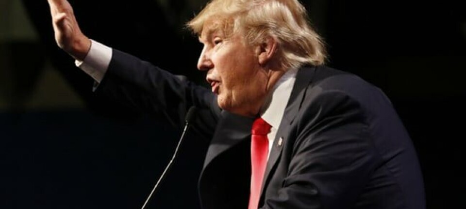 Donald Trump arm raised photo via Shutterstock