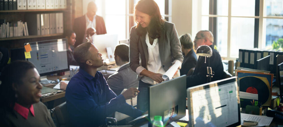 Office teamwork - cooperation developers and operations. pic by Shutterstock