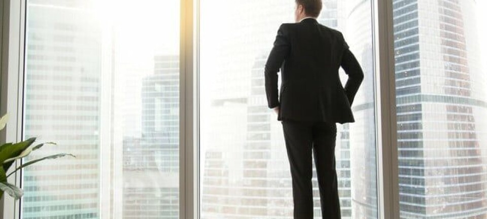 Businessman looking out window