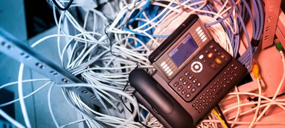 Generic shot of a VOIP / PBX system covered in network cabling