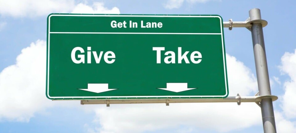Cloudy give and take road sign