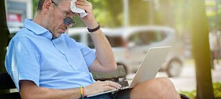 sweaty man uses ultrabook
