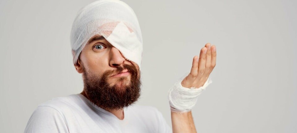 Bandaged man looks resigned