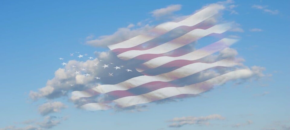 US flag blowing away in the cloud