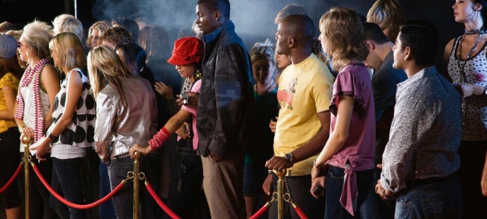 People waiting behind velvet rope. pic: Altrendo Images / shutetrstock