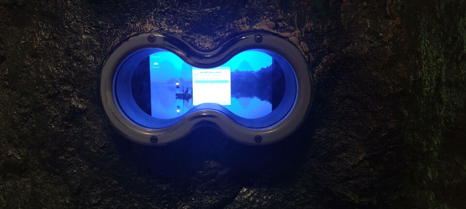 Viewport into rock showing a Raspberry Pi message