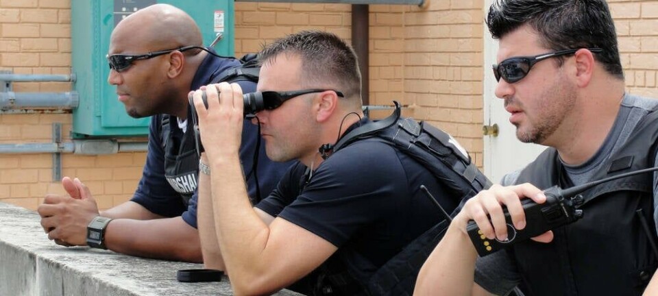 US Marshals perform rooftop surveillance (editorial Use Only.) Pic credit: Elliott Cowand Jr / Shutterstock