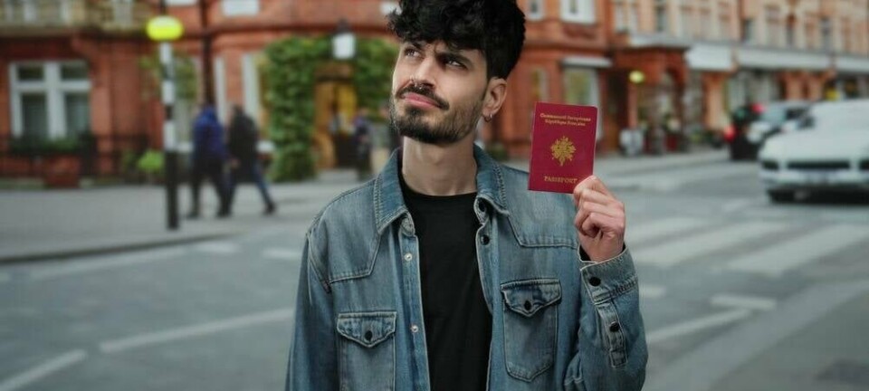 Man holds French passport on the street Krakenimages.com / shutterstock