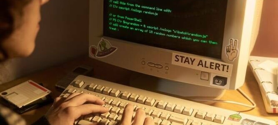 Individual working on programming project, retro PC. Pic credit: Pressmaster / Shutterstock