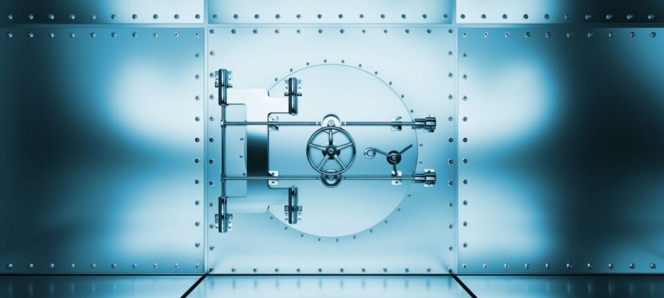 A blue-toned metal vault door with a circular locking mechanism set in a riveted steel wall