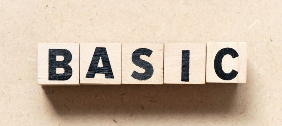 Scrabble-style letter tiles spelling BASIC on a beige background.