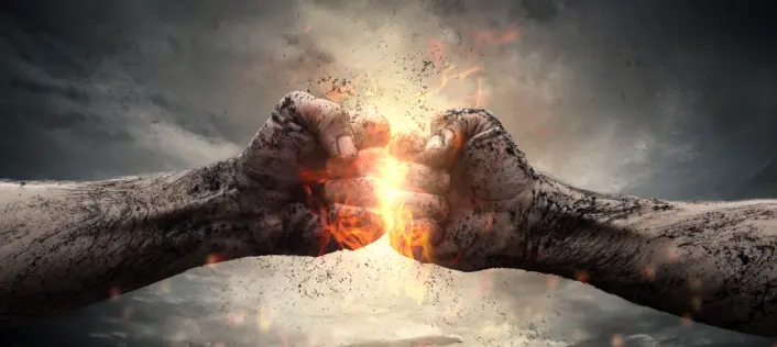Two clenched fists collide in a dramatic illustration with sparks and a dark background.